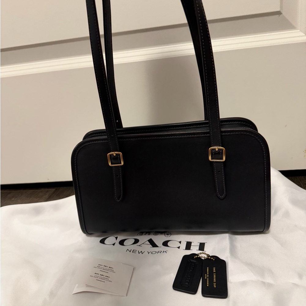 Coach swing zip